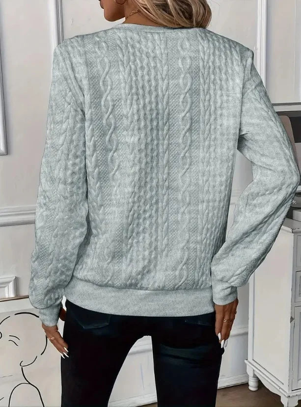 Sudadera con cremallera y textura: elegante y cómoda