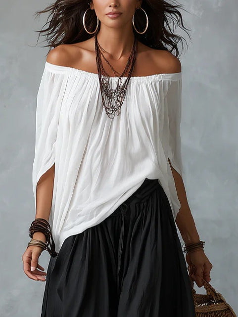 Conjunto de top blanco con hombros al aire y pantalón acampanado estilo linterna
