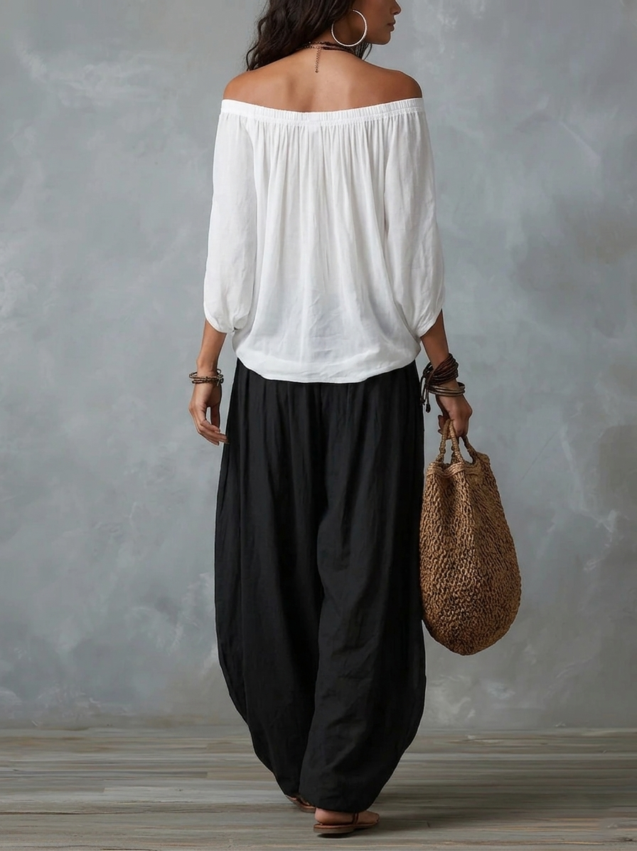 Conjunto de top blanco con hombros al aire y pantalón acampanado estilo linterna